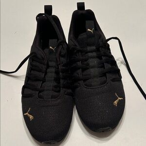 Puma Women’s Black and Gold Sneakers